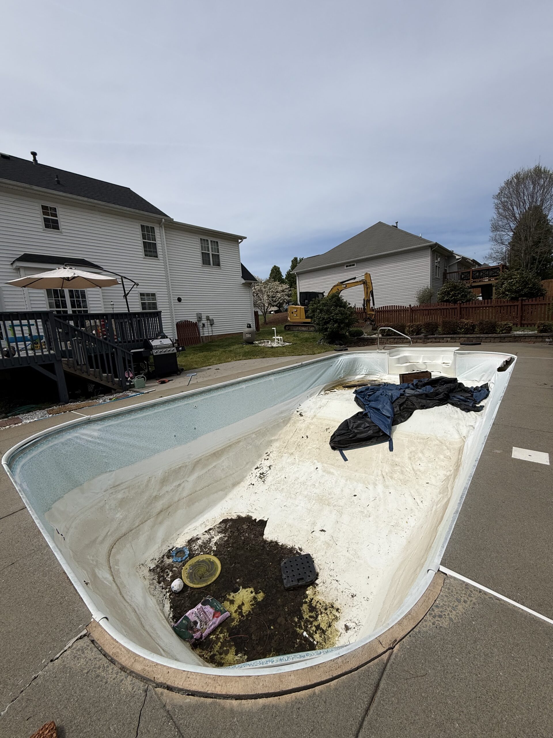 Backyard swimming pool before removal by Wallburg Dirt Worx
